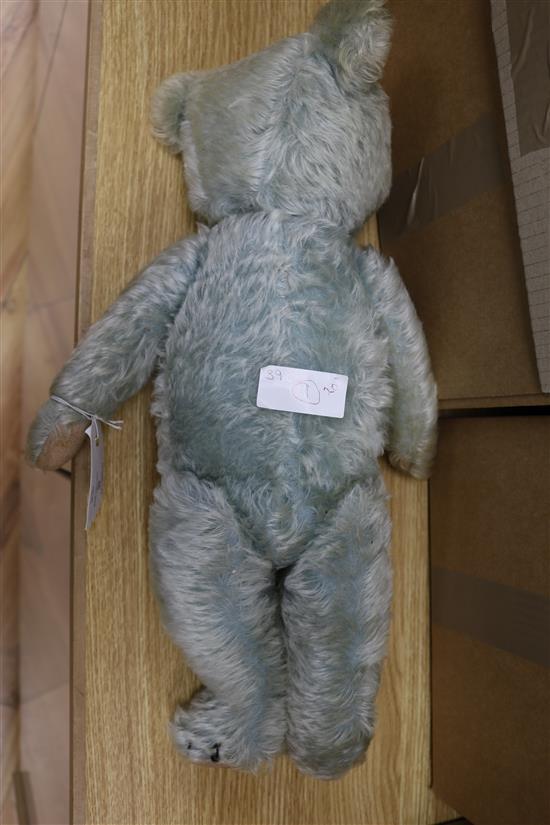 A 1930s blue Chiltern teddy bear, faded, 20in.